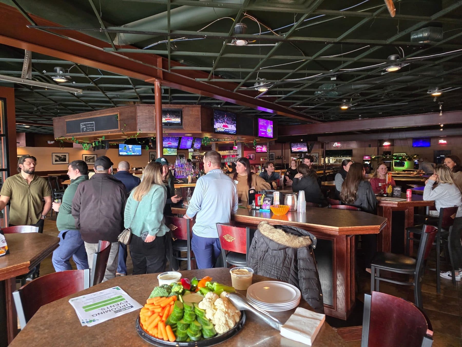 A crowded Chamber of Commerce networking event at a local restaurant